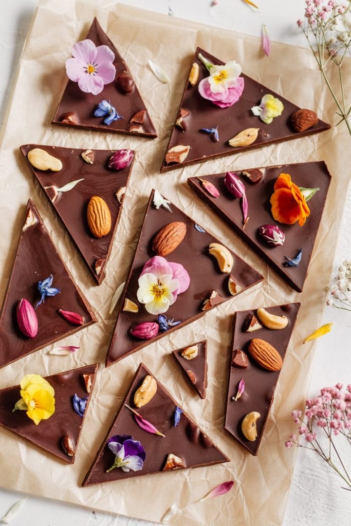 Artisan dark chocolate bark with edible flowers and nuts