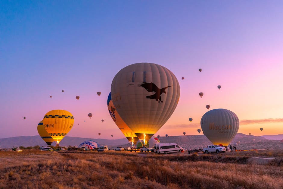 vibrant hot air balloons filling the sky at sunrise over Cappadocia