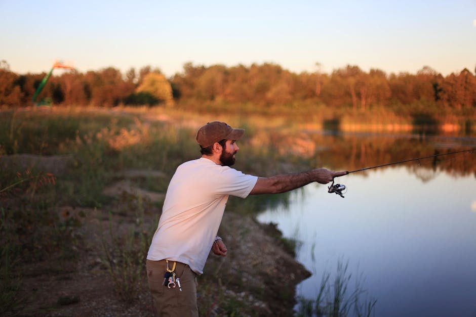 Step dad fishing by a calm lake, a Father's Day gift idea matched to his hobby