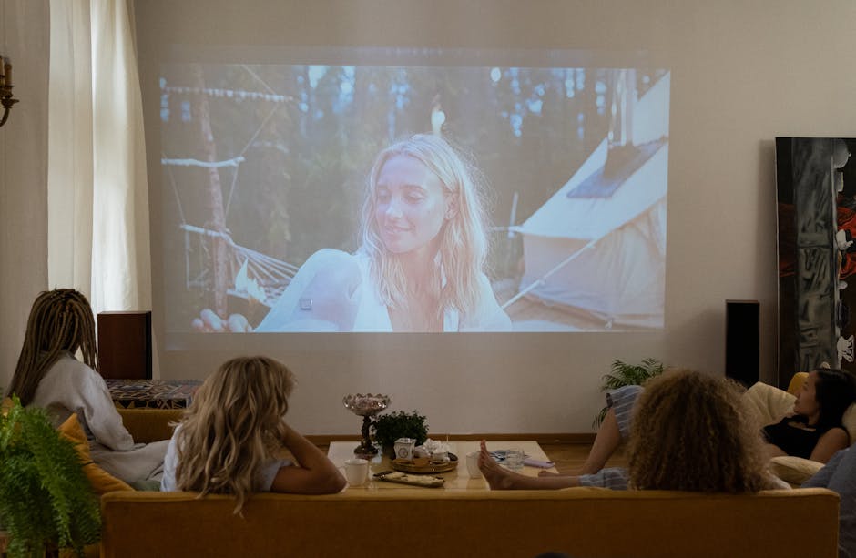 A movie night at home projected on a screen, a fun Father's Day gift idea for step dad
