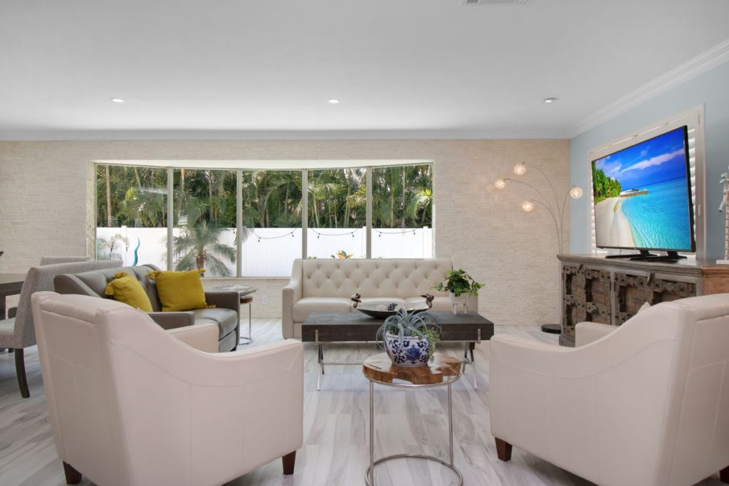 Modern living room with a large TV set up for a watch party