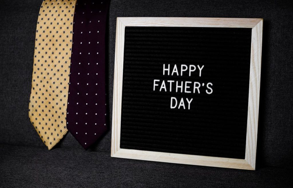 Neckties beside a Happy Father's Day letter board as DIY tie decoration